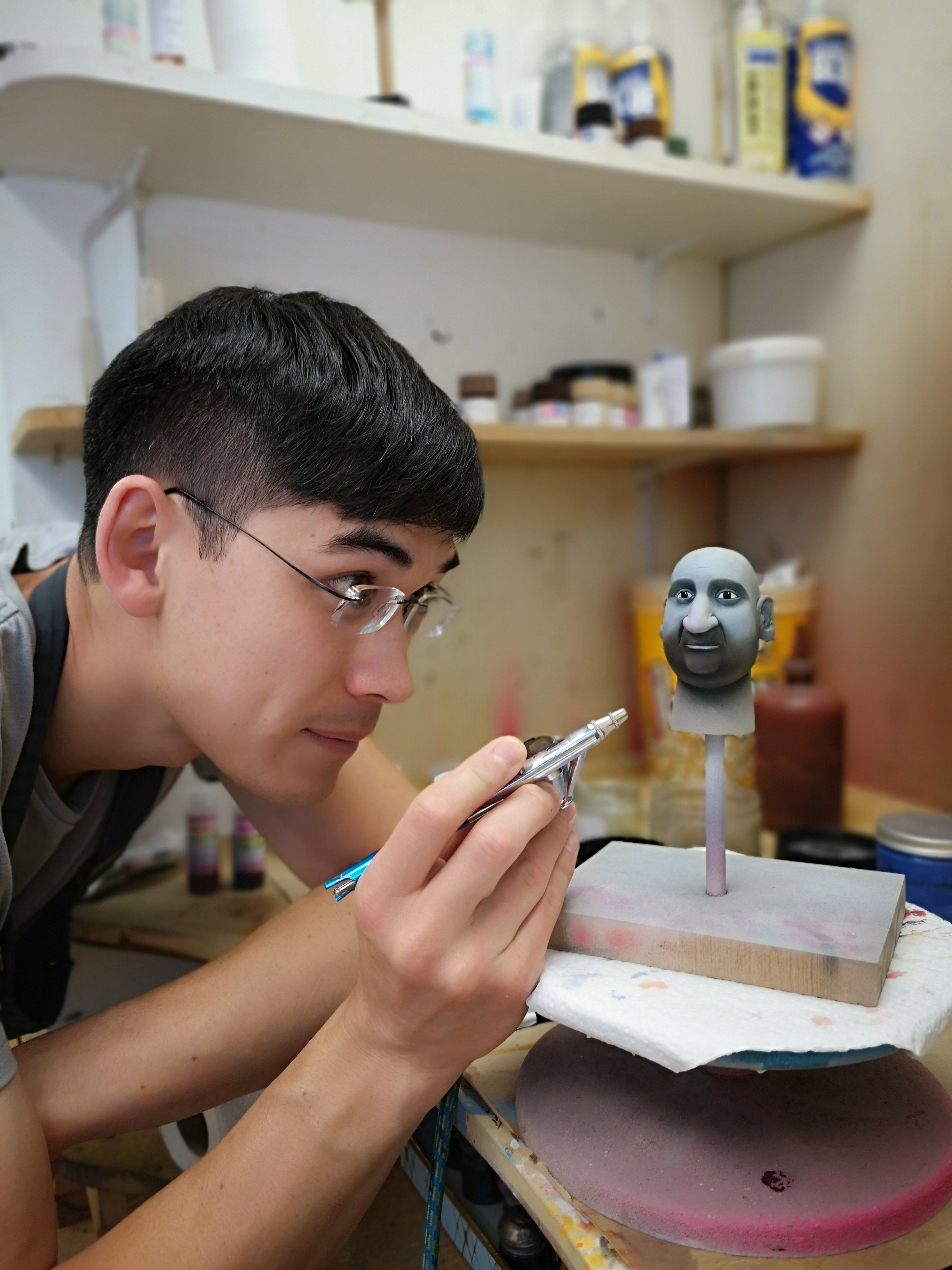 Artist creating a puppet face at Mackinnon and Saunders
