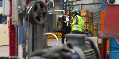 Female supervisor in a factory holding a tablet