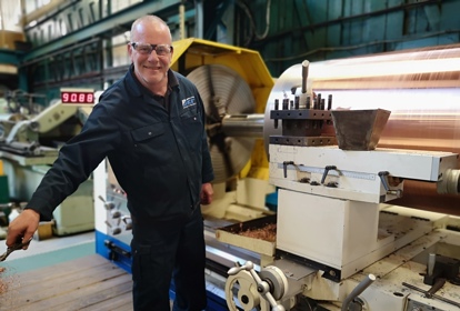 Engineer working on an industrial machine from BEP Surface Technologies