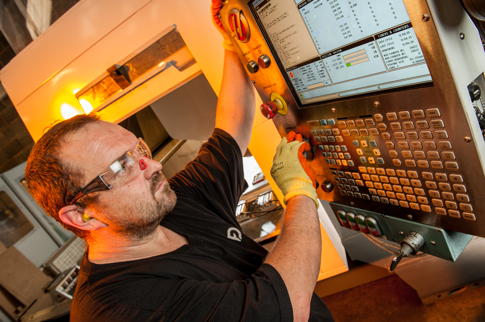 Engineer setting up a machine for production at Fabricon