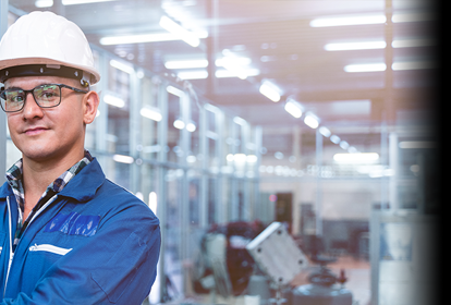 Portrait of manual man worker is standing with confident with blue working suite dress and safety helmet in front the glass wall of high technology clean industry factory.