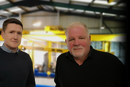 Hero banner - Senior leaders stood in front of shop floor at DT Engineering