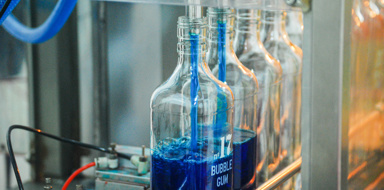 Bottles being filled on production line at Blends Holdings