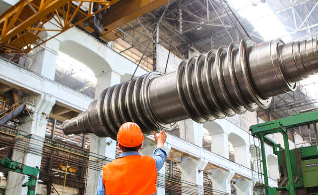 Manufacturing worker inspecting production line